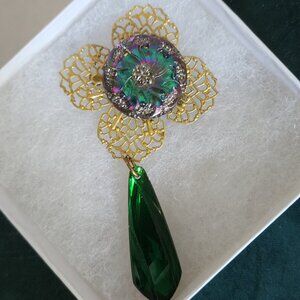 Vintage gold-tone, green, and purple brooch